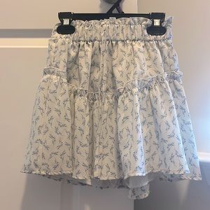 White with blue floral skirt